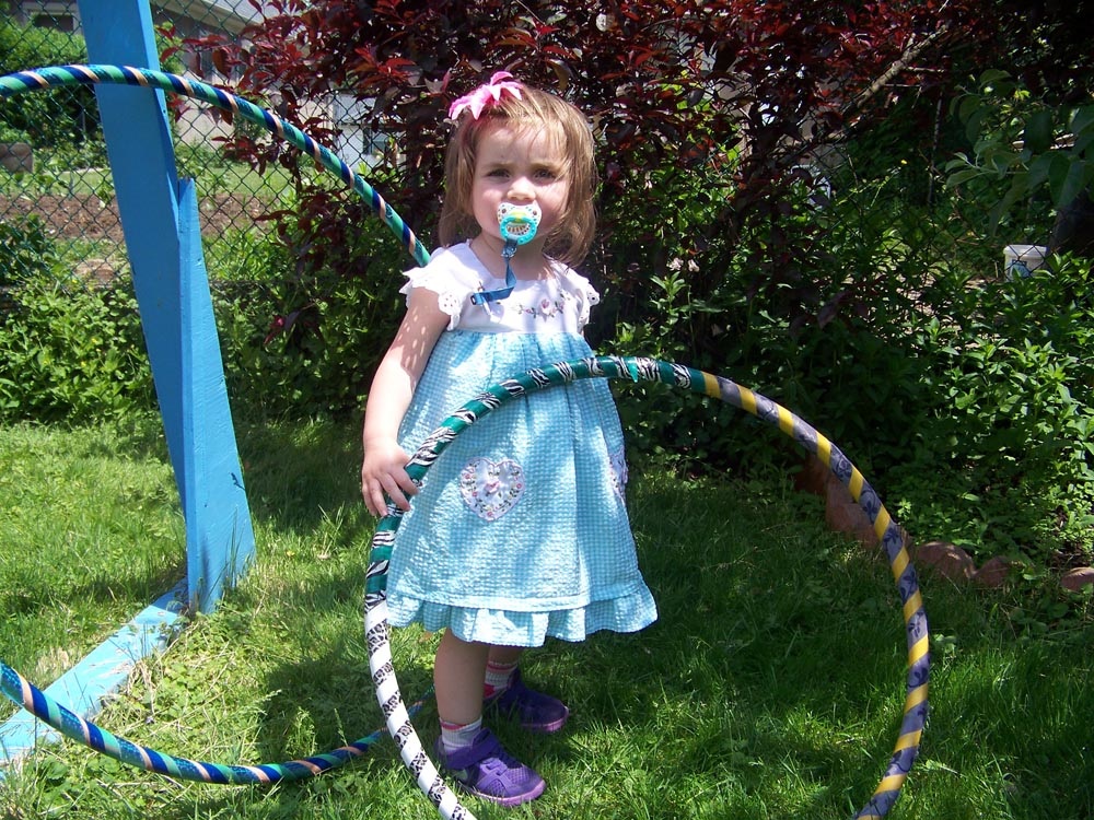 baby with hula hoops