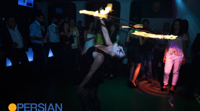 lucy loop dancing with a fire hoop doing a backbend