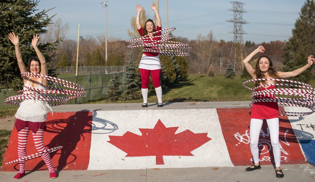 Canada 150 red and white hula hoop performers