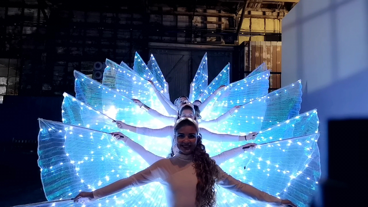 ice wings stack, led isis bellydance wing dancers in a pose